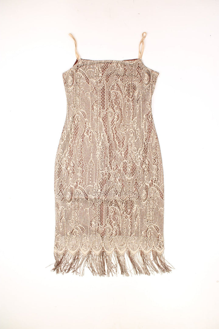 Vintage Etam Midi Fringed Crochet Dress in a gold and brown colourway, metalic crochet shell with a brown nylon lining, and has tassels at the bottom. 