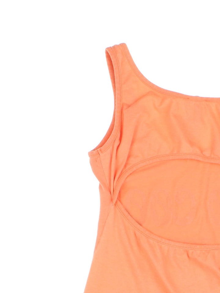 Y2K Dolce and Gabana vest top in orange with a back cutout, and beaded text on the front reading 'Too Cool For School' and a printed company logo.