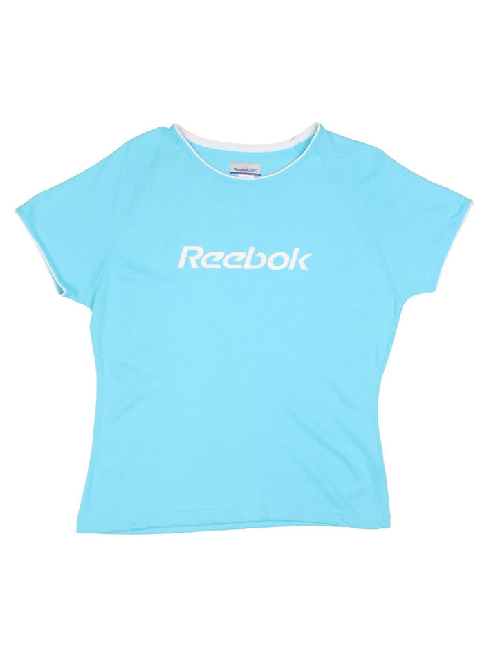 Reebok baby in blue with white piping and an embroidered spellout on the front.