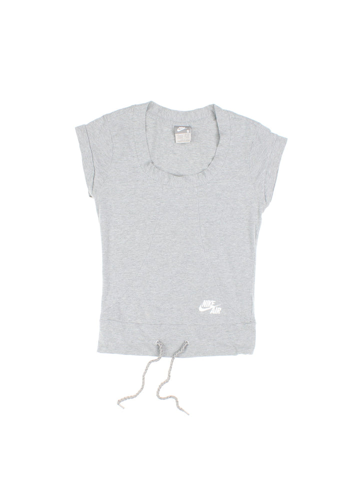 Y2K Nike Air baby tee in grey marl with a drawstring at the waistband, an embroidered logo on the front, and a small branded tab on the back hem.