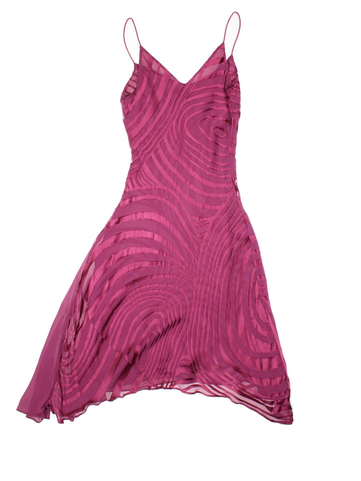 Y2K Monsoon midi dress in a deep pink with abstract swirl designs.