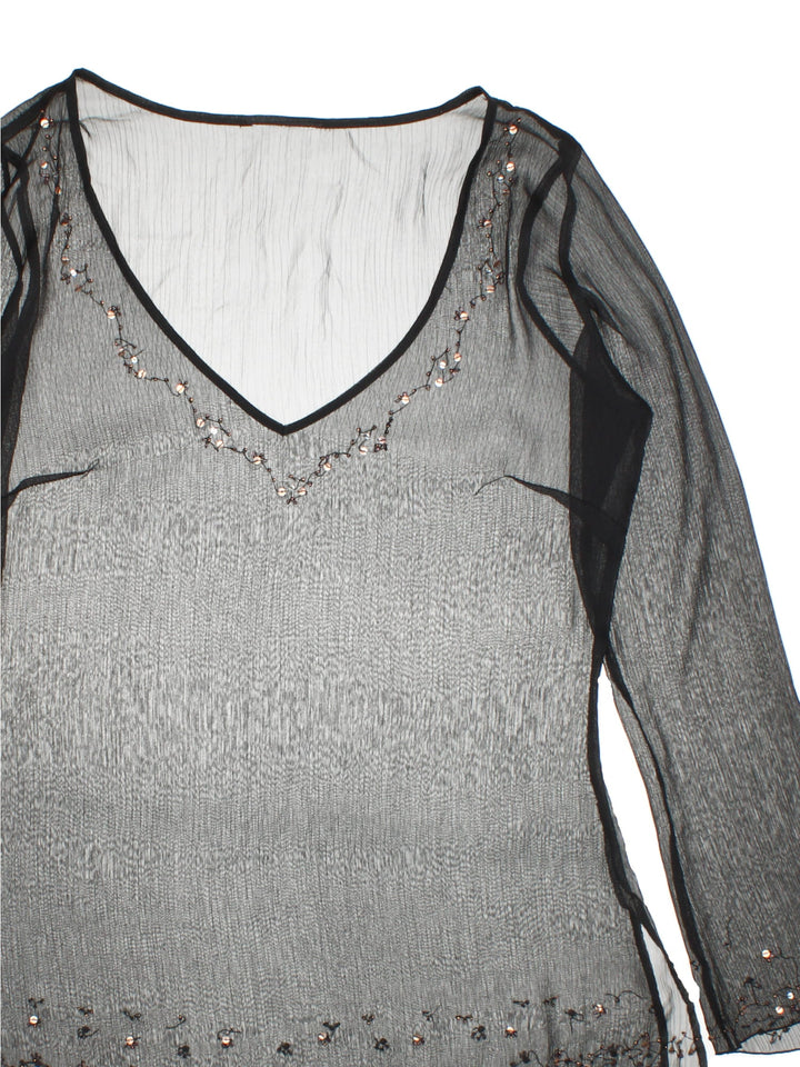 Y2K sheer top in black with bead and sequin detailing around the hem, collar, and cuffs.