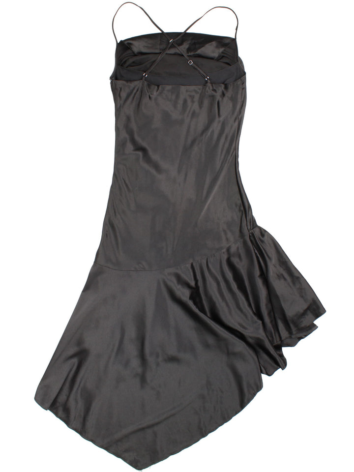 Y2K ruched cowl neck evening dress in black with adjustable crossed straps, an asymmetrical hem, and zip closure by Celo.