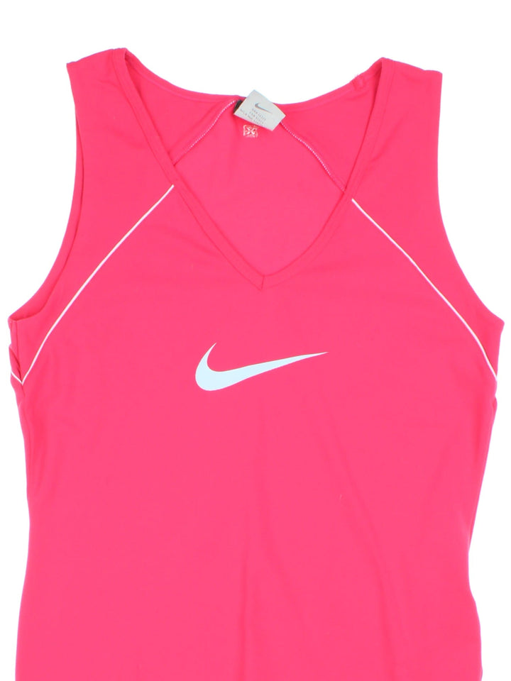 Vintage Nike Y2K vest top in a pink colourway with piping along the seams and the Nike logo printed on the front. Made from a two way stretch fabric. 