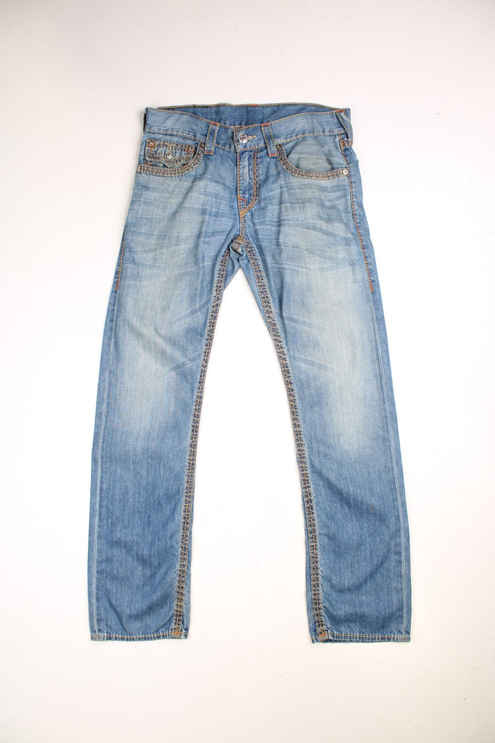 Y2K True Religion jeans in light blue denim colourway with pockets and the logo embroidered on the back.