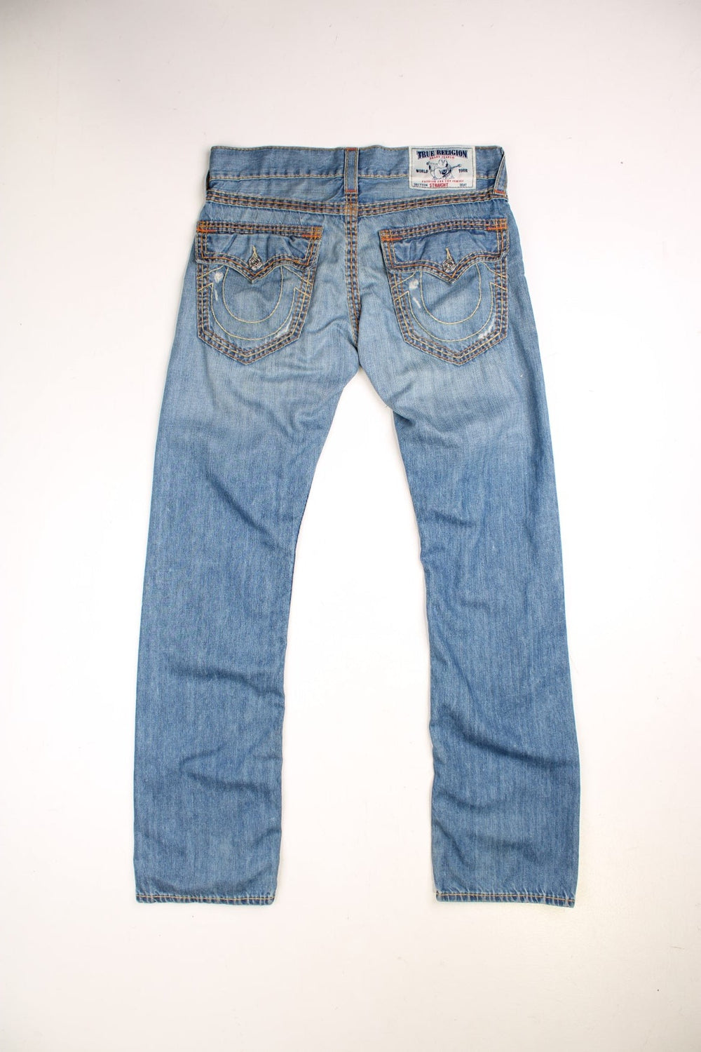 Y2K  jeans in light  denim colourway with pockets and the logo embroidered on the back.