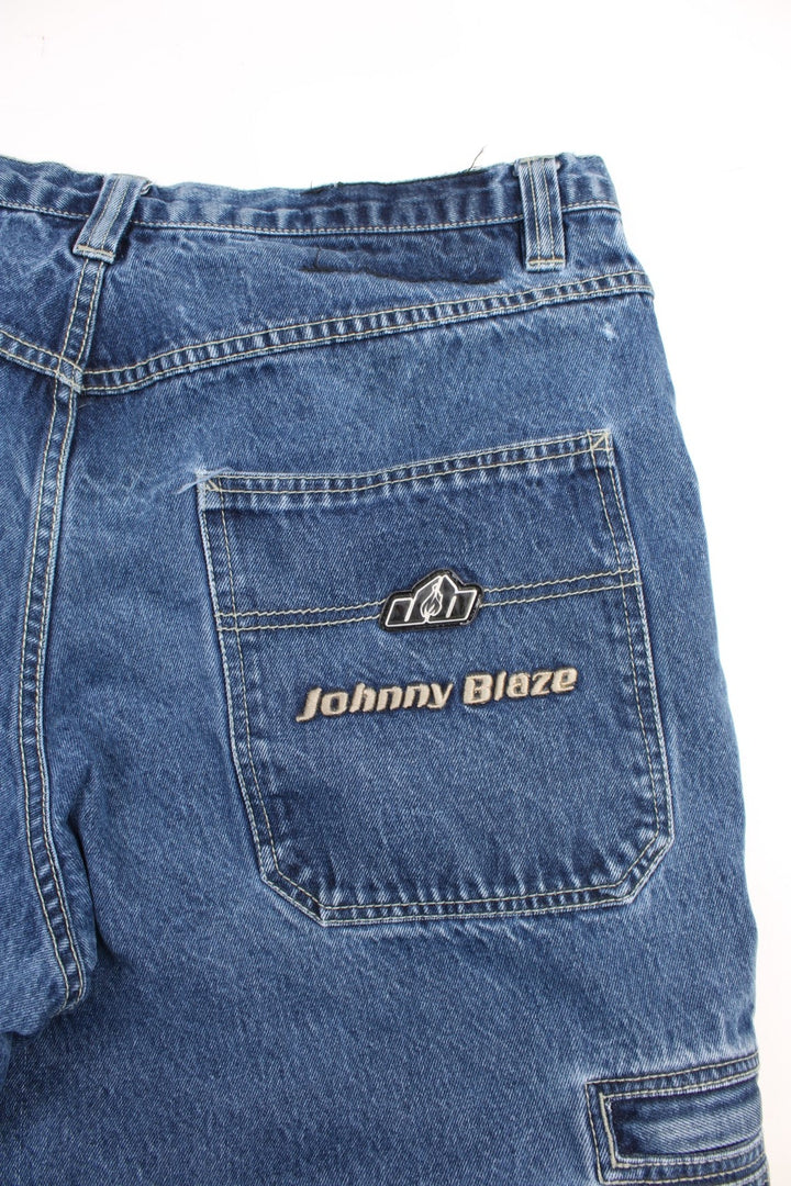 Johnny Blaze  Baggy Cargo Jeans in  colourway with multiple pockets and the logo embroidered on the pockets.