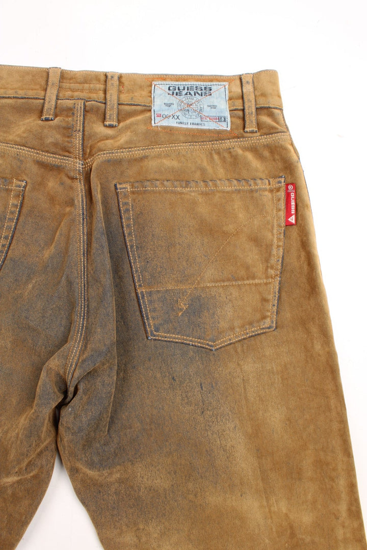 Y2K  Distressed Trousers in  colourway, material similar to suede, has pockets and the logo embroidered on the back.