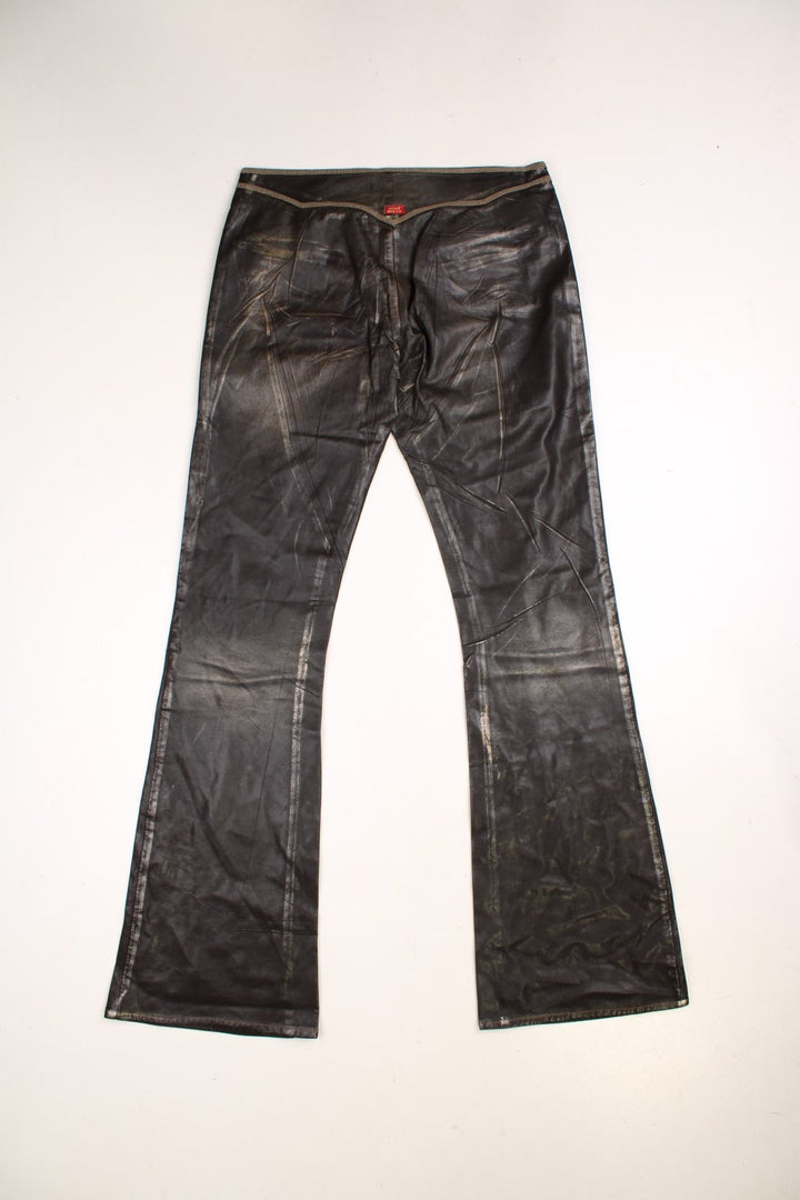 Y2K  Flared Pleather Trousers in  colourway with pockets, low rise, and has the logo embroidered on the back.