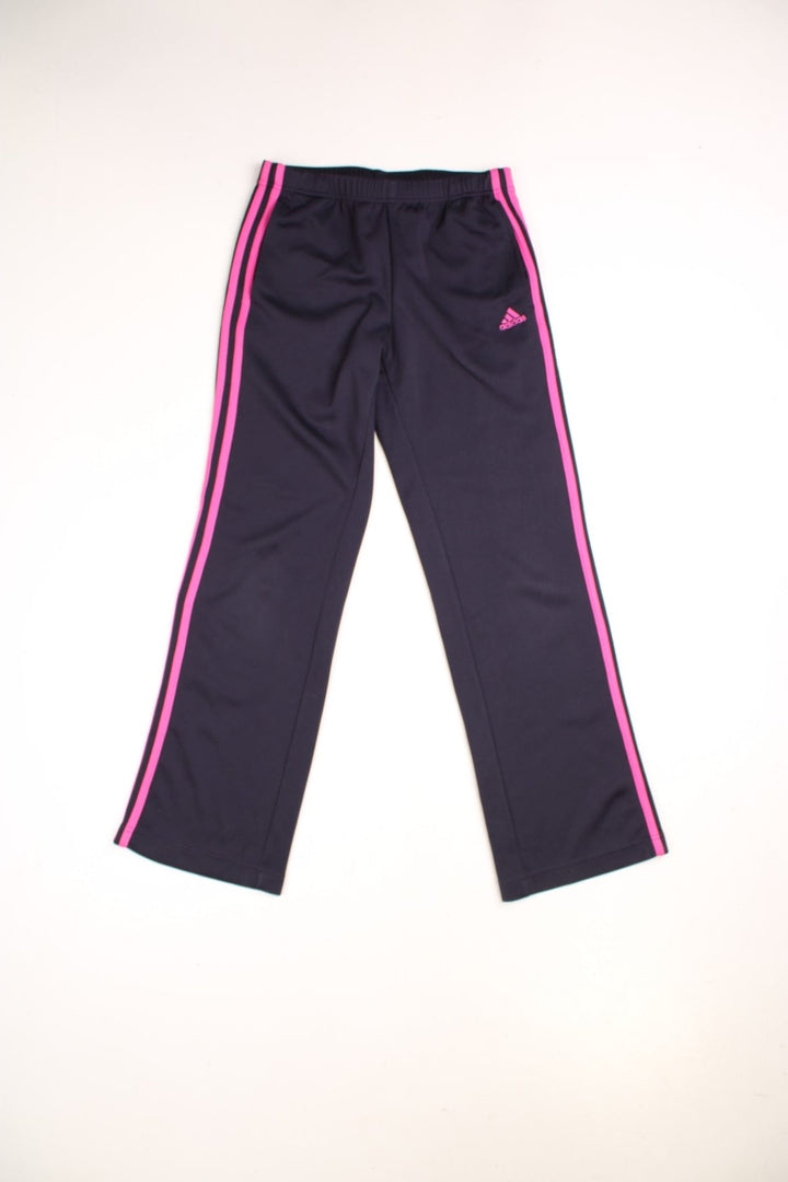 Adidas Tracksuit Bottoms in a navy blue and pink colourway with the iconic three stripes going down the legs, has side pockets, an adjustable waist with drawstring and the logo embroidered on the front.