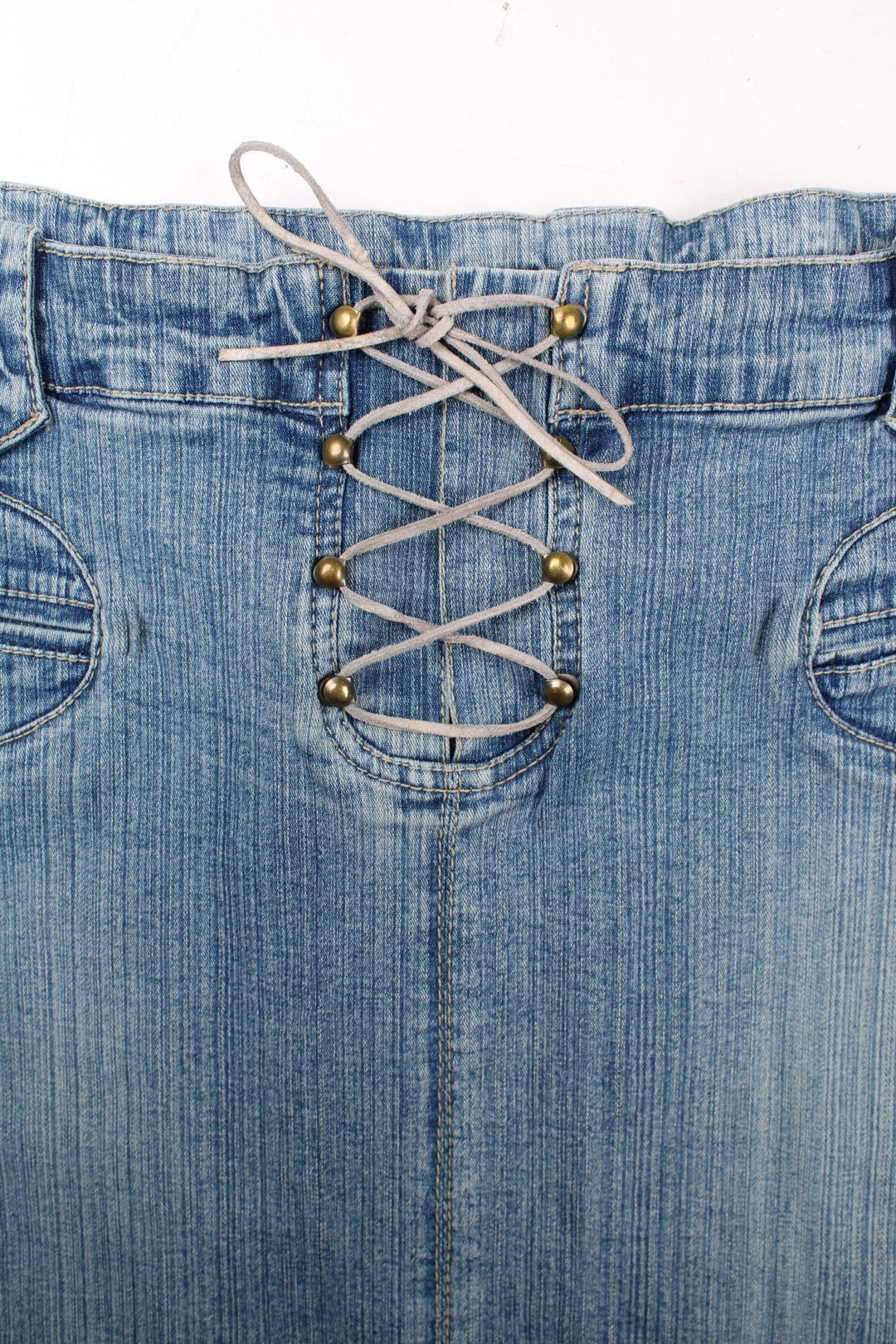 Y2K denim lace-up midi skirt in a light blue wash with belt loops, two pockets, and concealed button closure by Pilot.