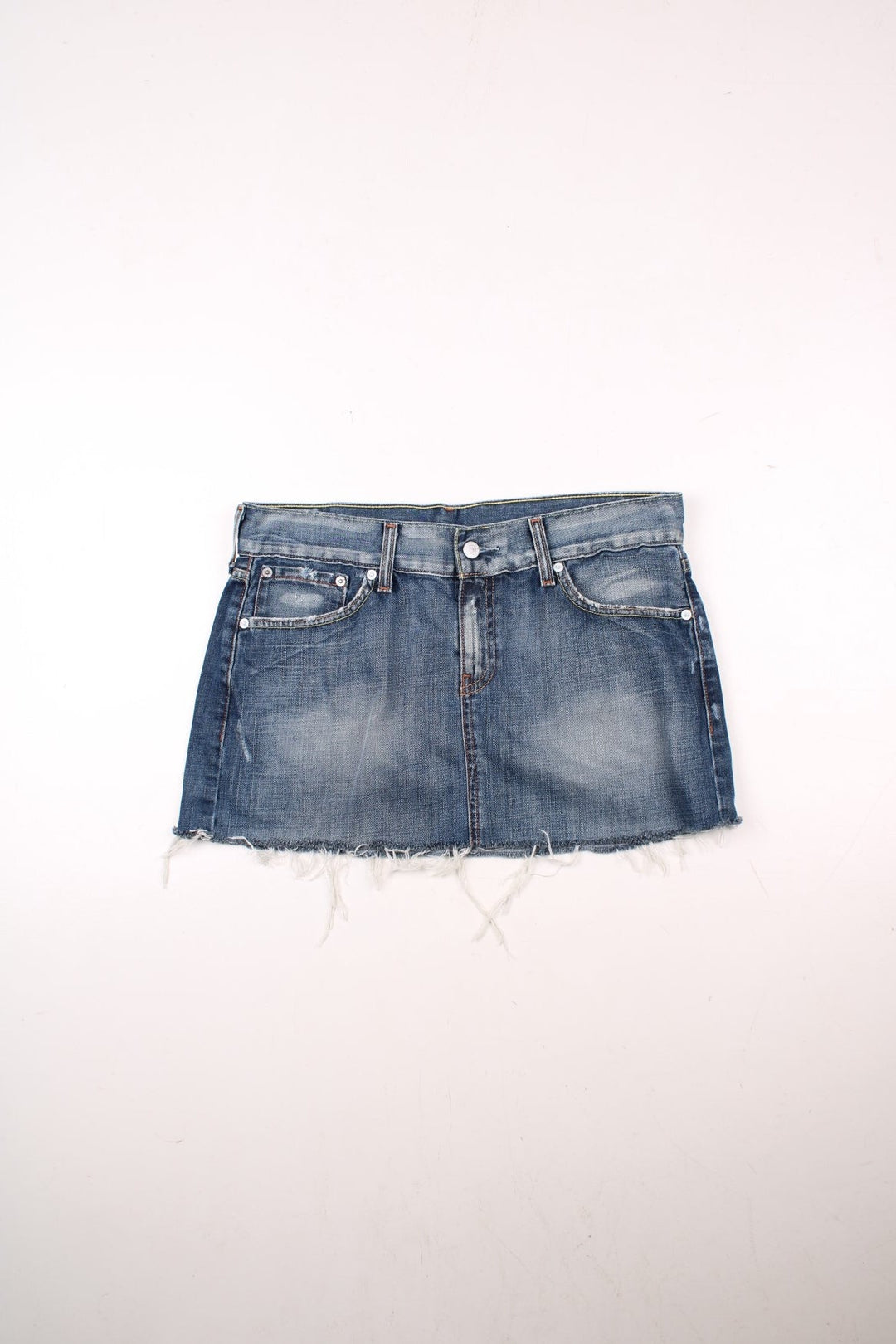 Y2K Levi Strauss denim mini skirt in blue with zip and button closure, four pockets, a raw hem and distressing to pockets, a buckle tightener in the back and a Levi's cowboy patch.