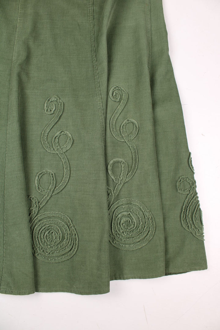 Y2K Marks & Spencer fine corduroy A-line maxi skirt in green with applique swirl designs .