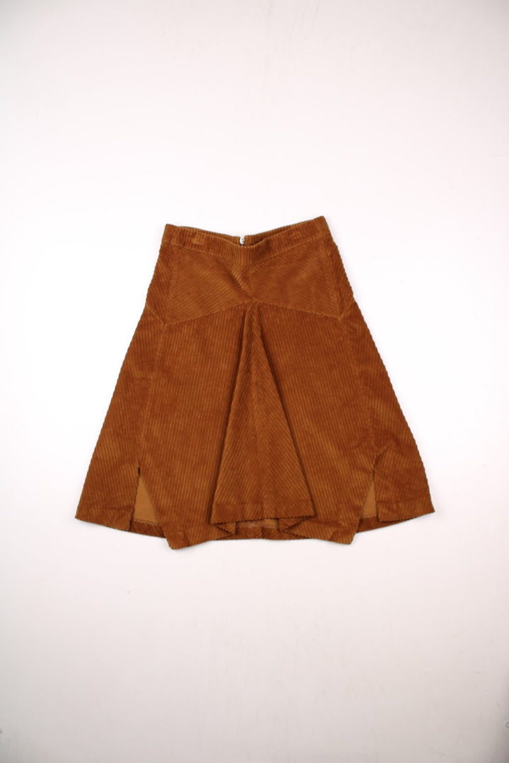 Y2K panelled corduroy midi skirt in tan with a small slit at the hem and zip closure by Dixie.