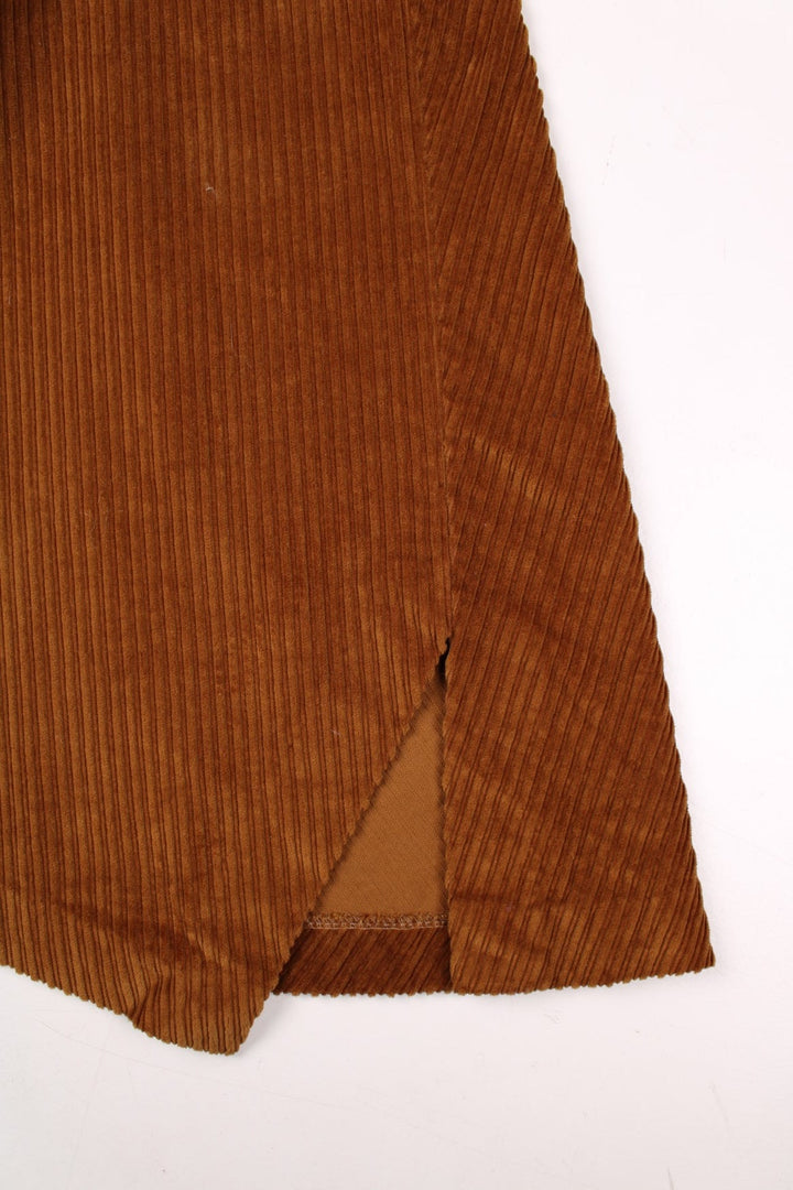 Y2K panelled corduroy midi skirt in tan with a small slit at the hem and zip closure by Dixie.