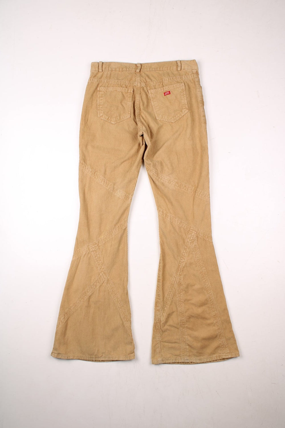 Y2K Miss Sixty panelled corduroy slim-fit flared trousers in tan with four pockets, button closure, and red logo patches front and back.