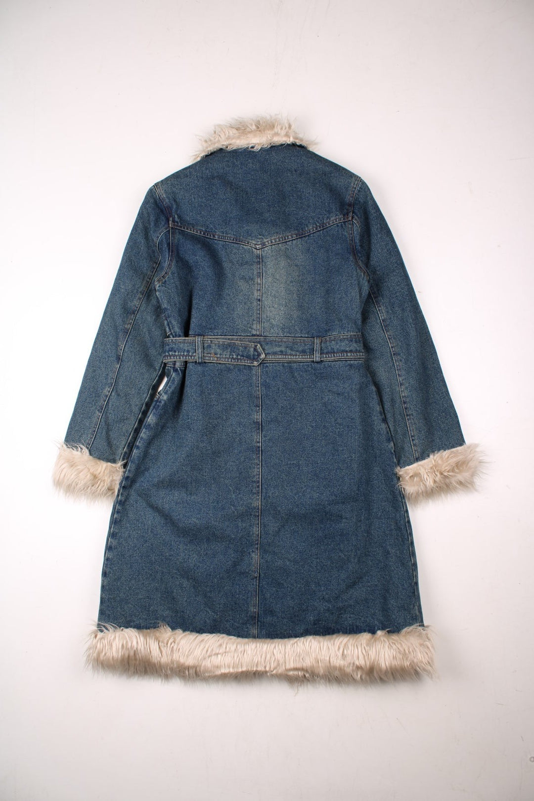 Y2K denim afghan coat in a mid blue wash: quilt lined with faux fur trim, multiple pockets, hook and eye closure, and a belt, by Hongma Fushi.