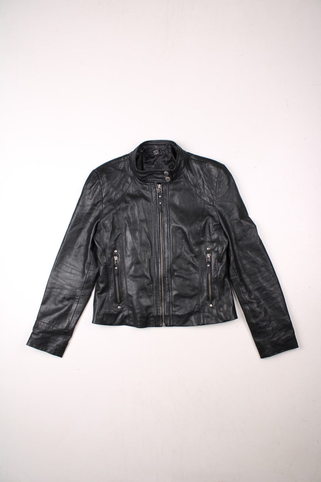 Y2K Aviatrix jacket in black real leather with two pockets, zip and snap closure, and branded hardware.