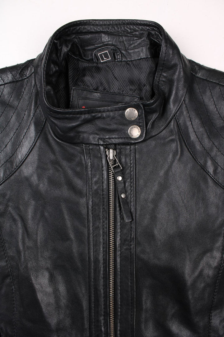 Y2K Aviatrix jacket in black real leather with two pockets, zip and snap closure, and branded hardware.