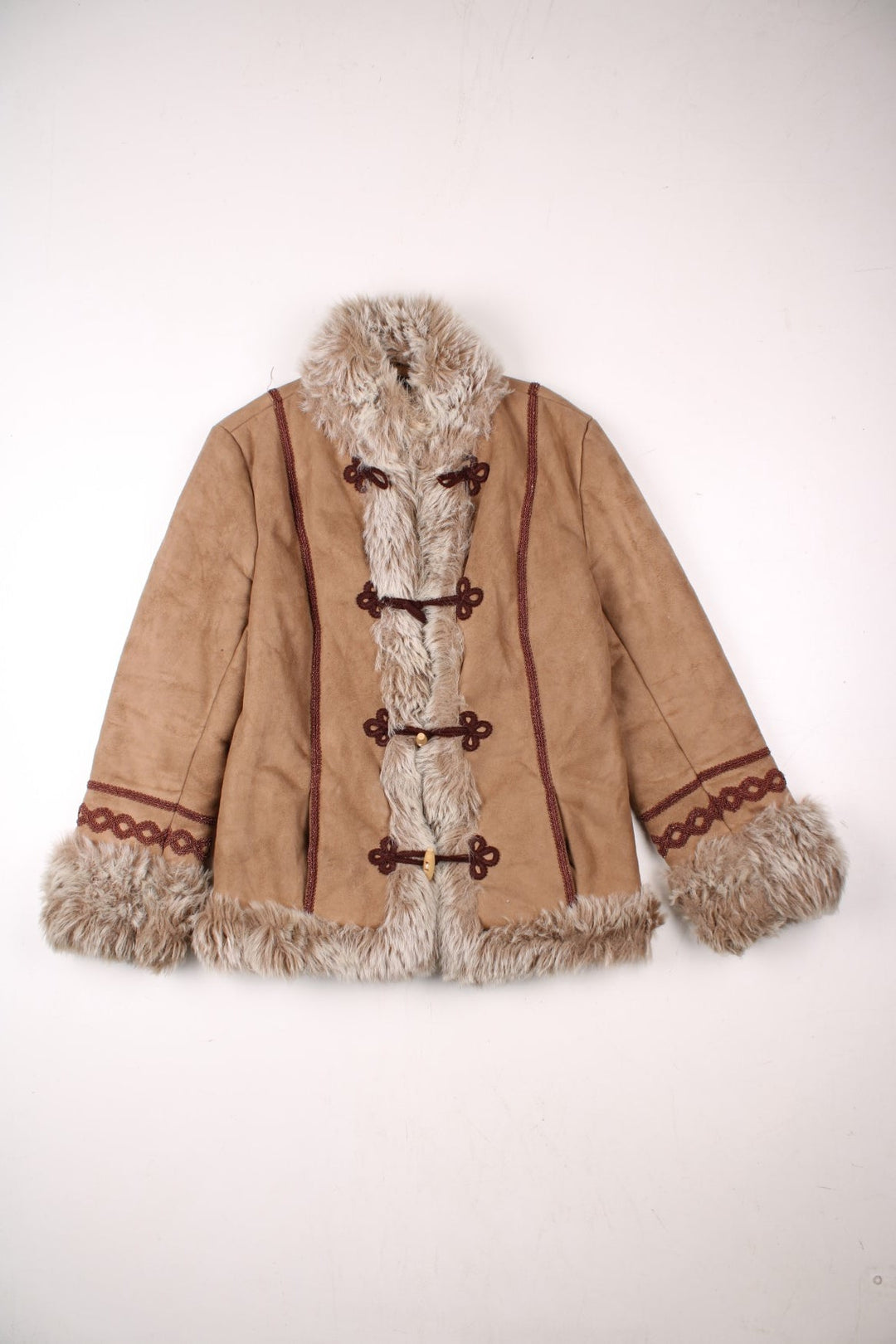 Y2K Fiorelli suede-effect afghan coat in tan with faux fur trim, toggle closure, and red embroidery.