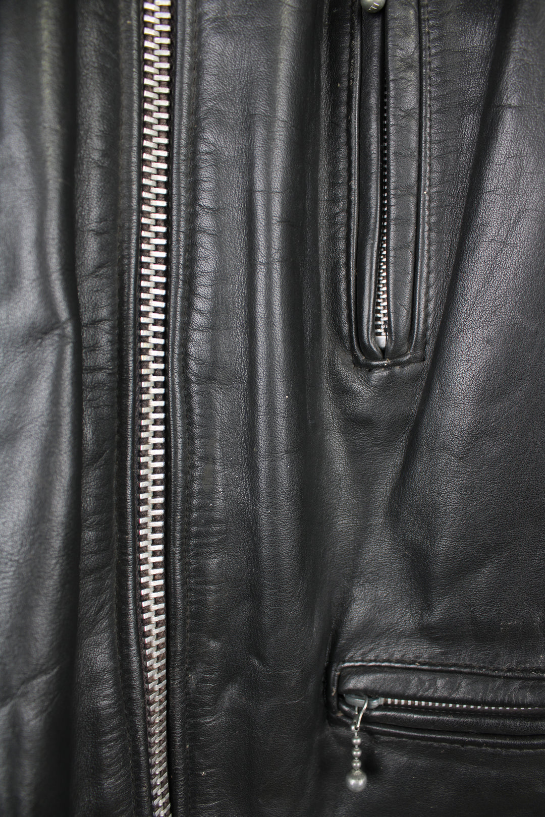 Vintage Highwayman black leather zip through biker jacket, features zip up pockets and adjustable buckle details on the hips