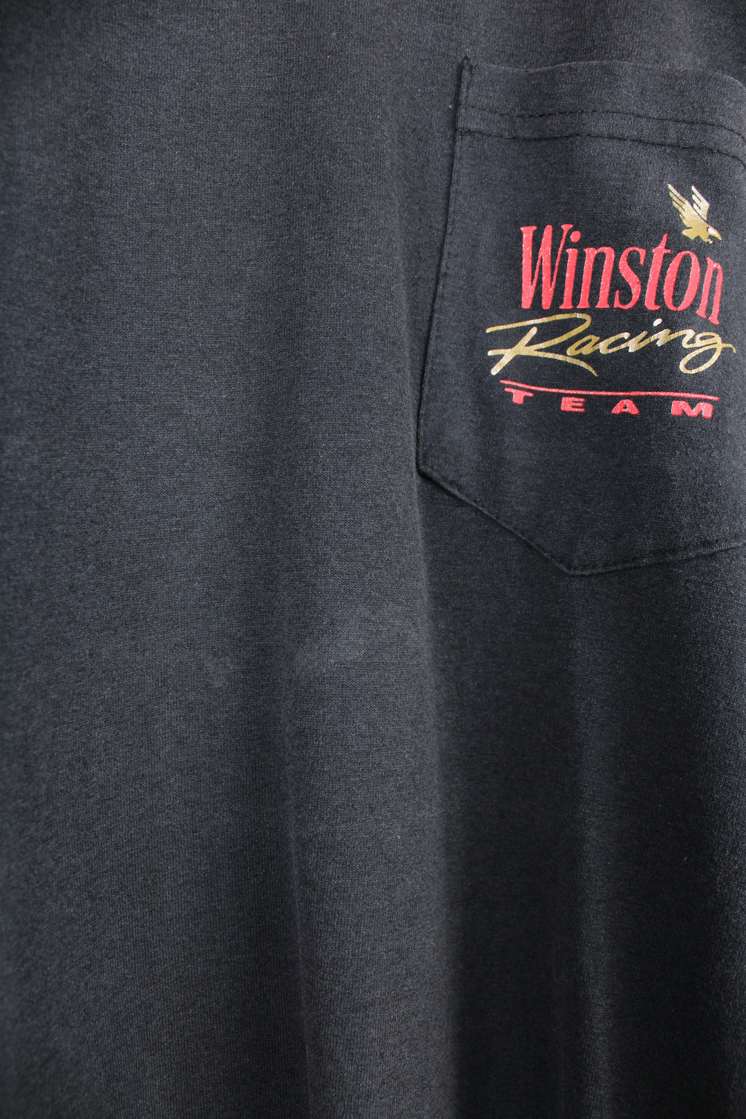 Vintage made in the USA looks like 90's single stitch Winston Racing t-shirt with chest pocket and printed graphics on the front and back 