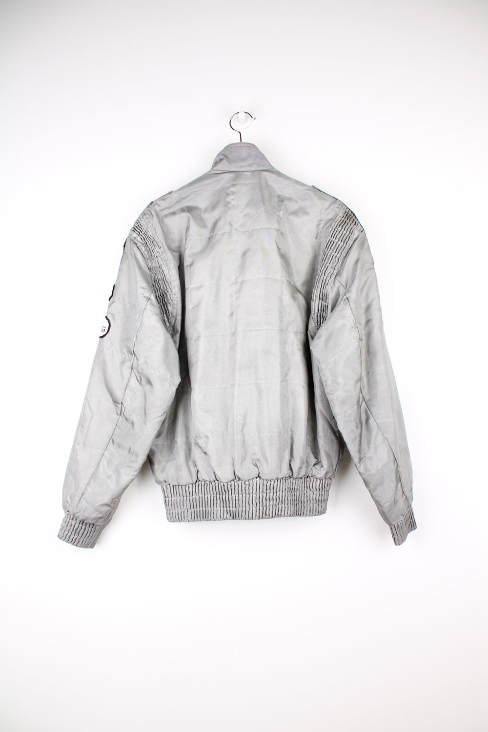 Vintage Alpha Cubic nylon bomber style formula 1 racing jacket in grey, features all over embroidered badges/patches and full zip