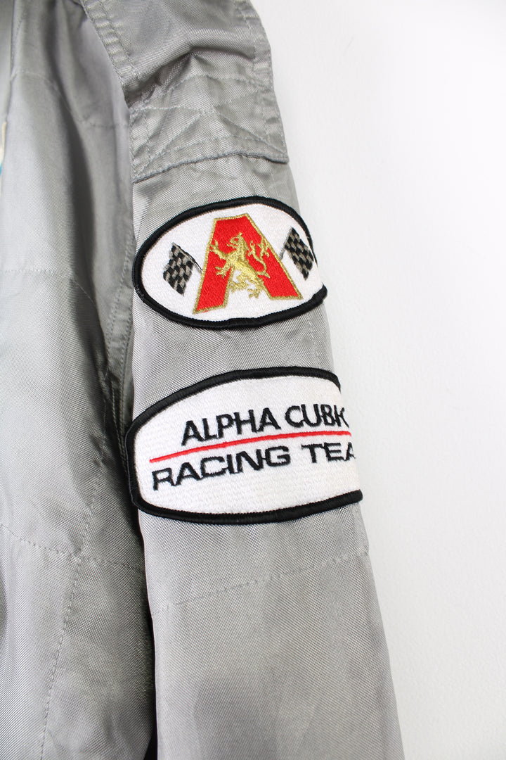 Vintage Alpha Cubic nylon bomber style formula 1 racing jacket in grey, features all over embroidered badges/patches and full zip