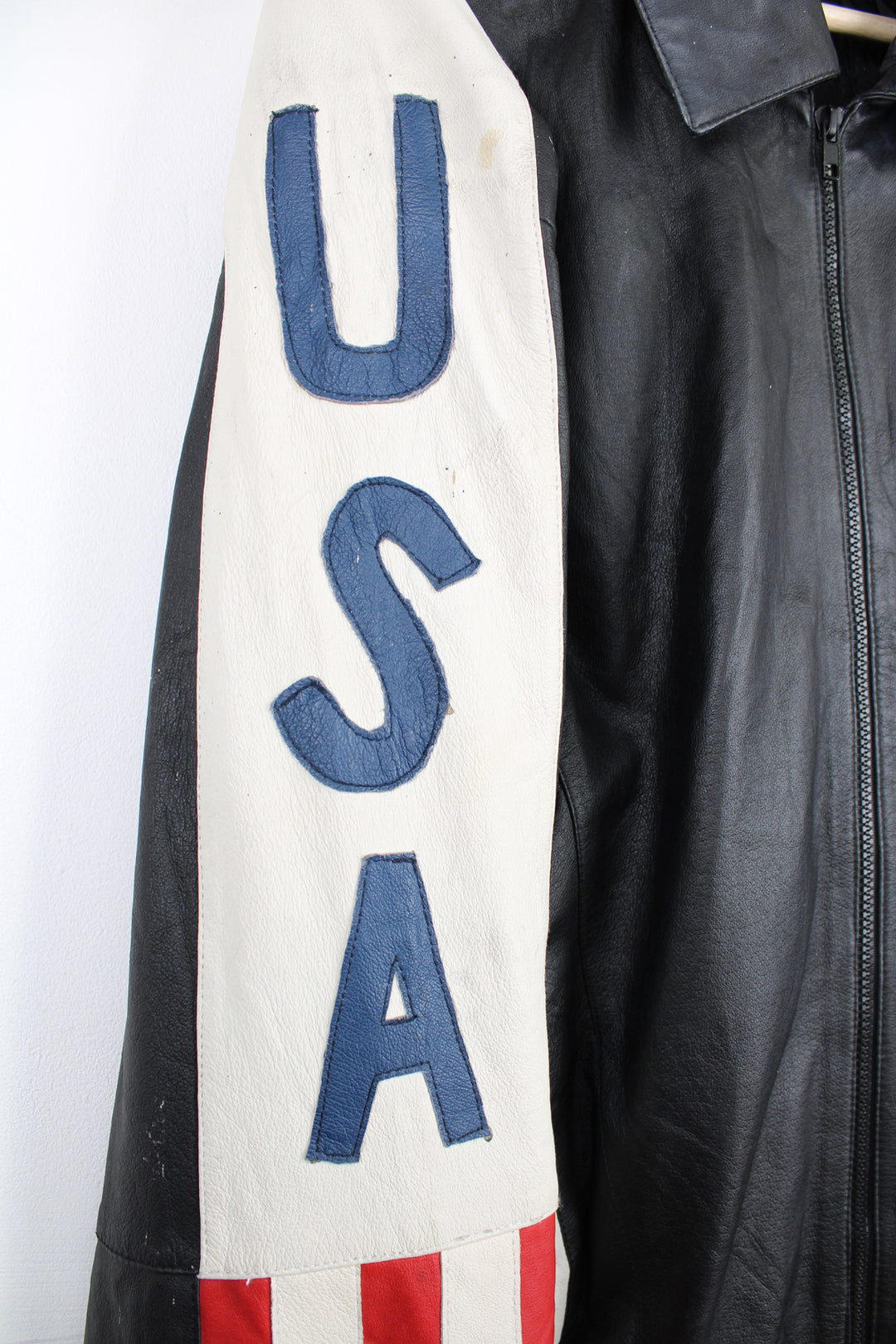 Vintage 90's style USA themed leather bomber jacket with spell-out detailing down the sleeves and USA flag on the back 