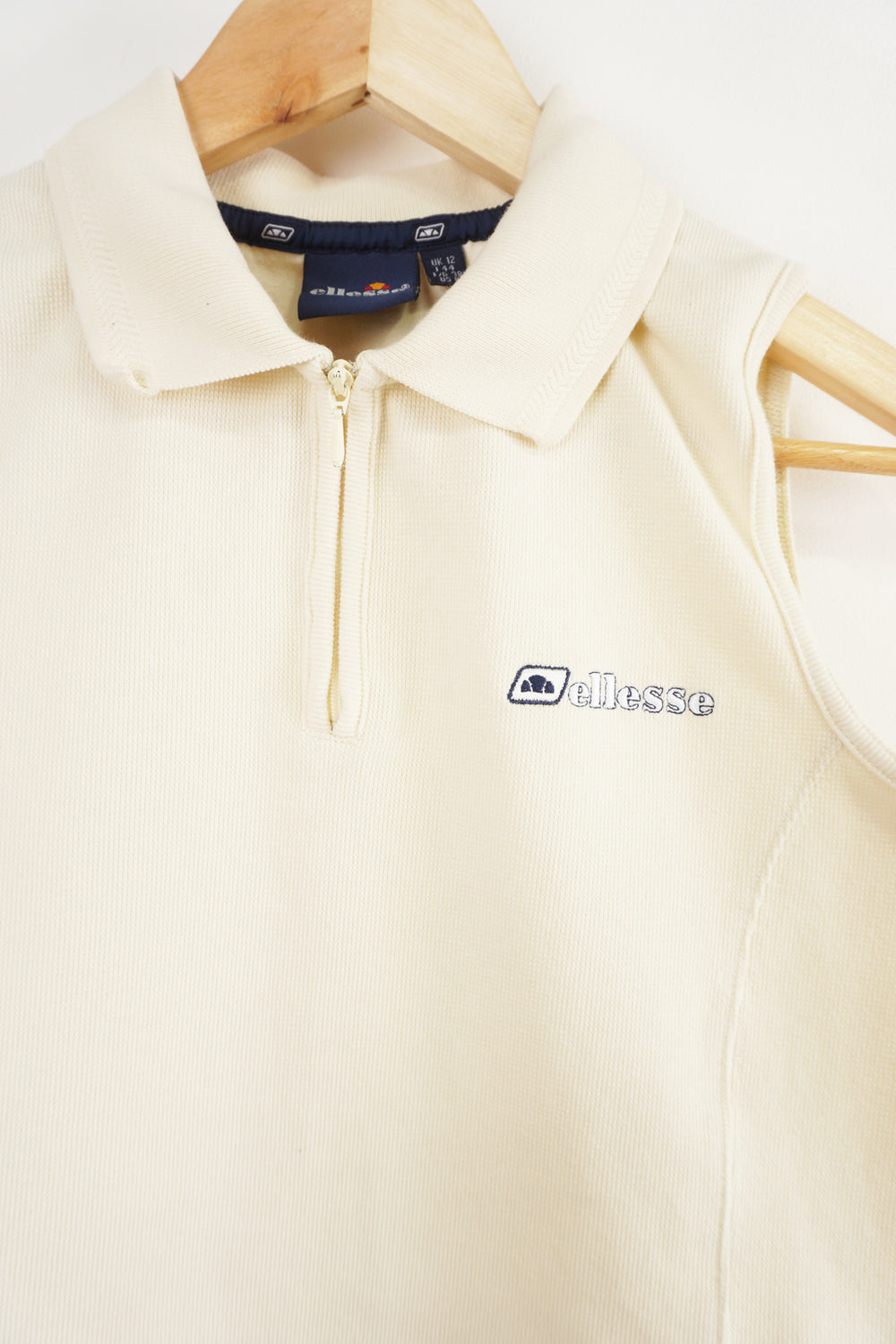 Cream Ellesse 1/4 zip vest with collar and embroidered Logo on chest