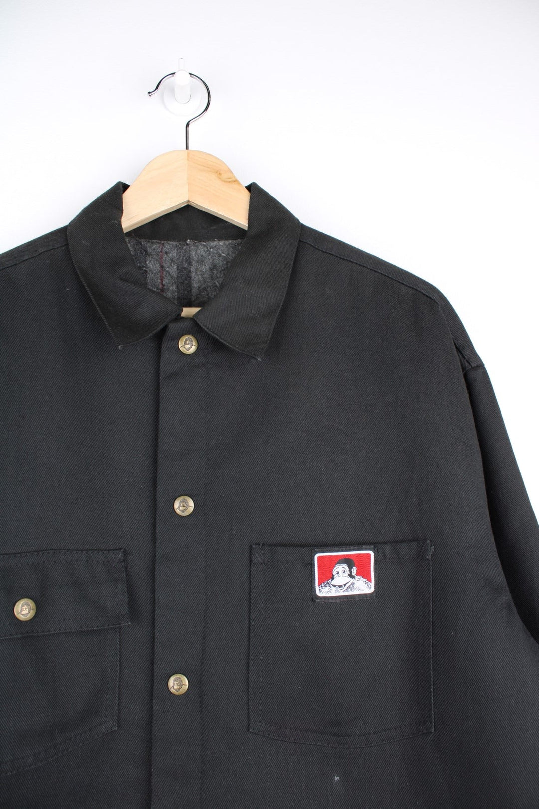  Chore Jacket in a  colourway. Buttons up and has multiple pockets, insulated with a blanket lining, and has the logos embroidered on the front.