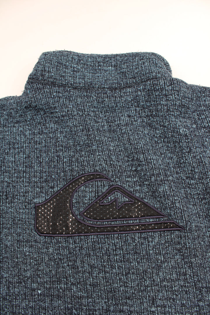 Blue Quiksilver 1/4 zip knit jumper with embroidered logo on the chest and back. good condition - some light bobbling in places Size in Label: Mens M - Measures oversized, more like a L/ XL 