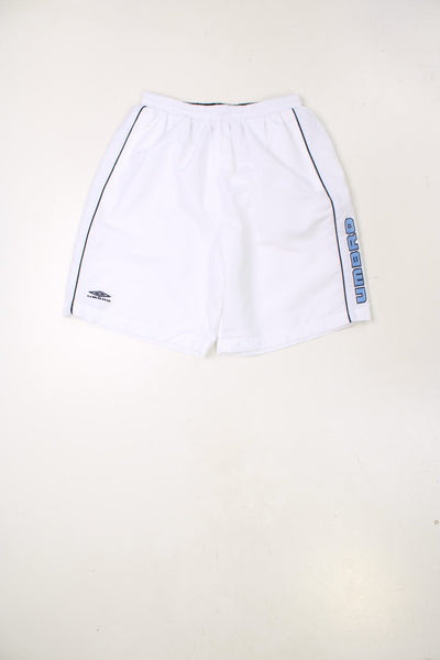 Vintage Umbro Shorts in a white colourway, has an adjustable waist, side pockets and the logo and spell out both embroidered on the front.