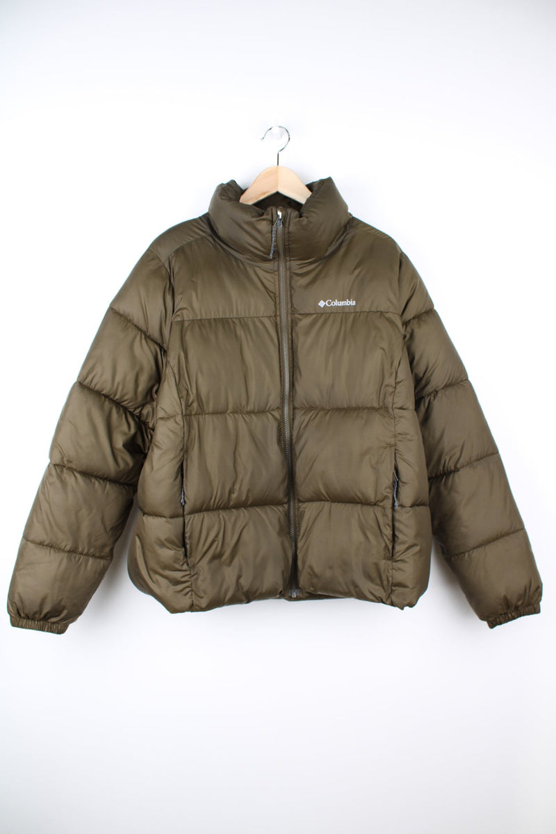 Khaki Columbia zip through puffer jacket. Features printed logo on the chest.