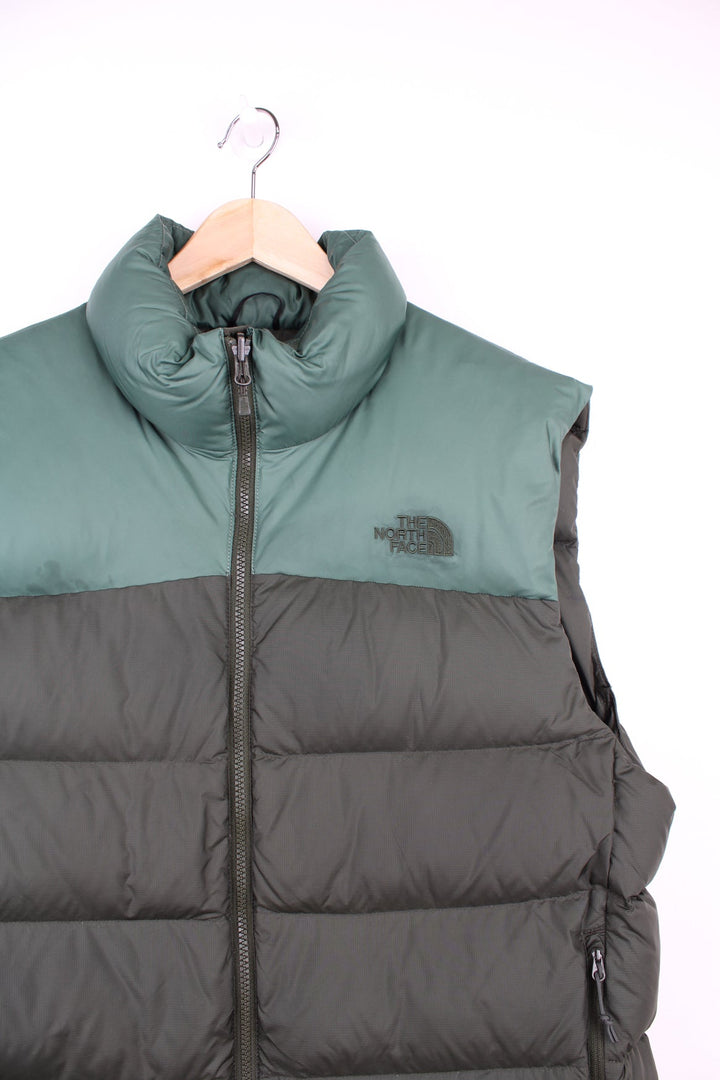 The North Face puffer gilet in green featuring embroidered logo on the chest. 