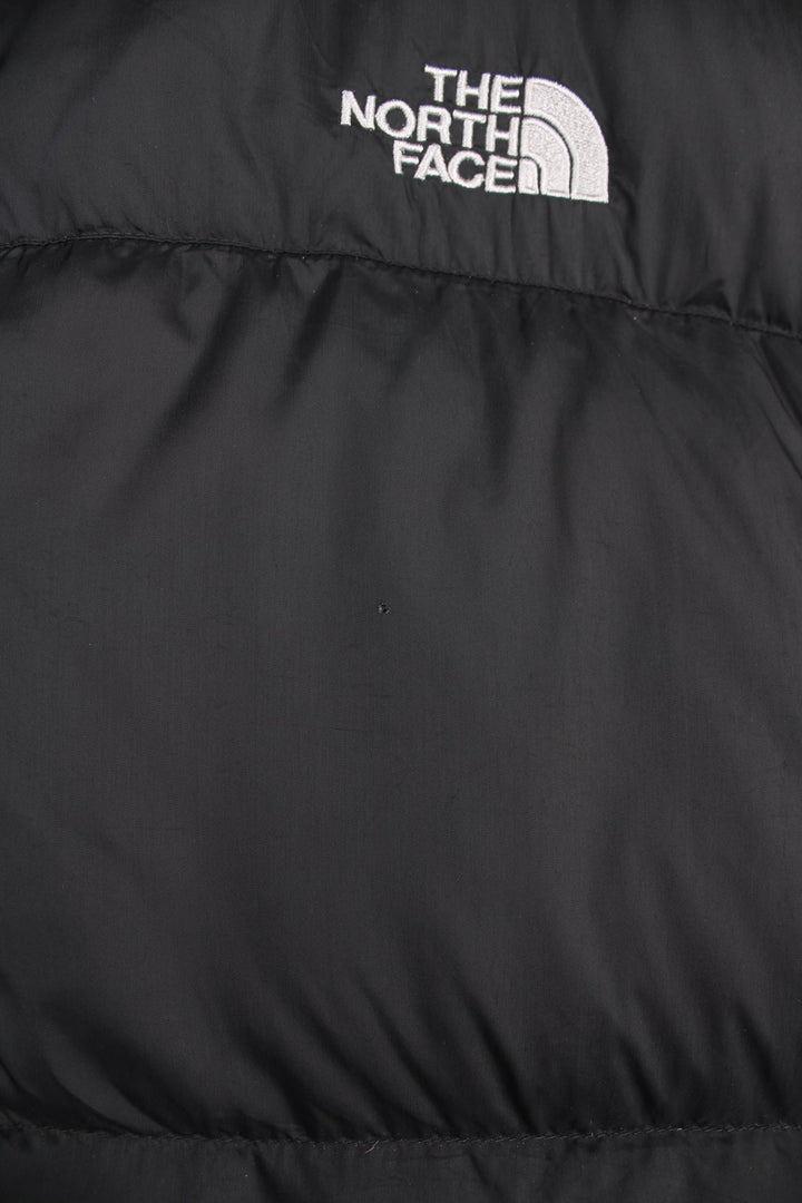 The North Face 550 black gilet. Features embroidered logo on the front and back.