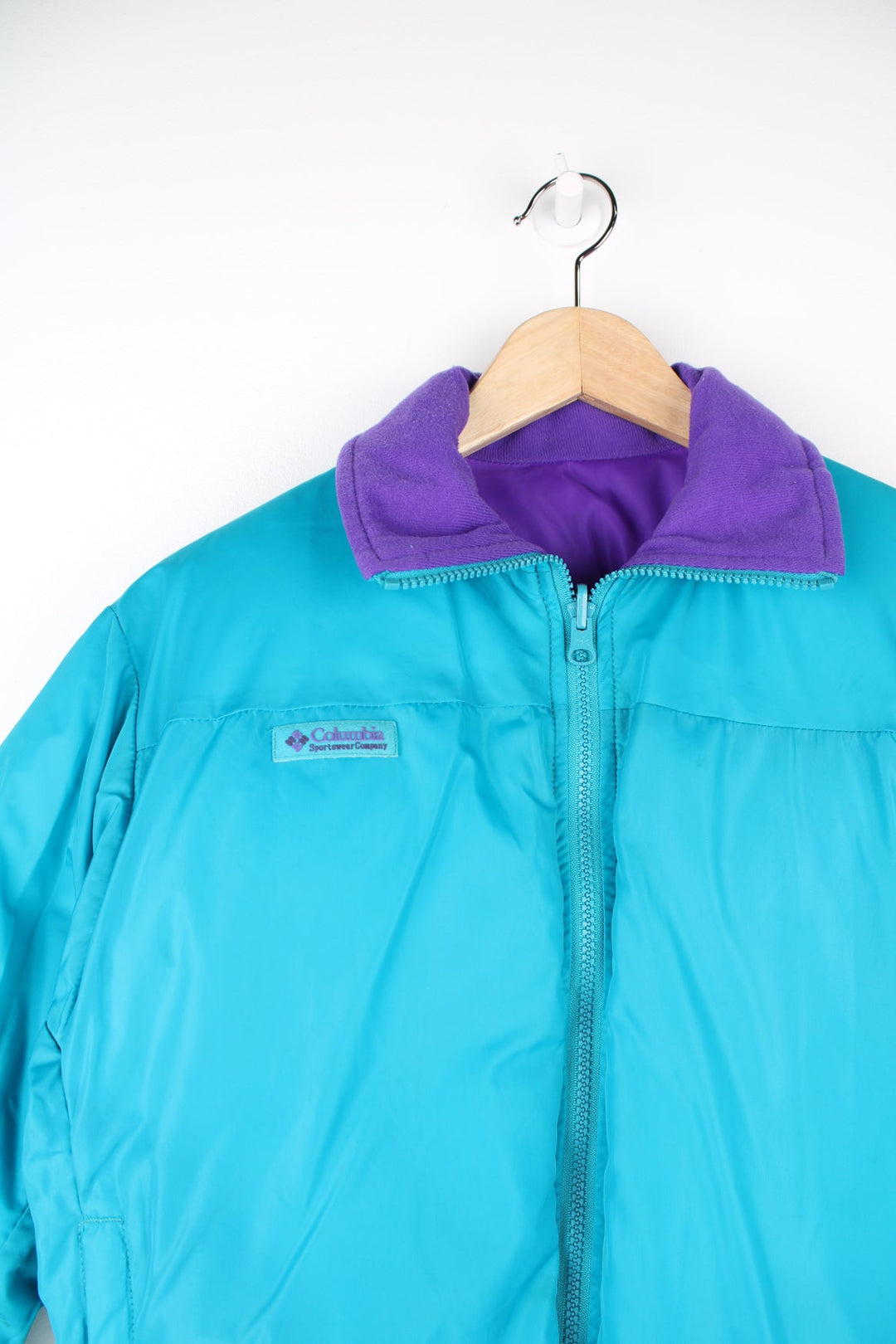 Vintage Columbia reversible puffer jacket in purple and green. Features puff print logo on the chest.