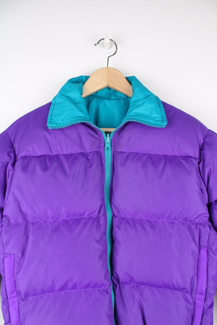 Vintage Columbia reversible puffer jacket in purple and green. Features puff print logo on the chest.