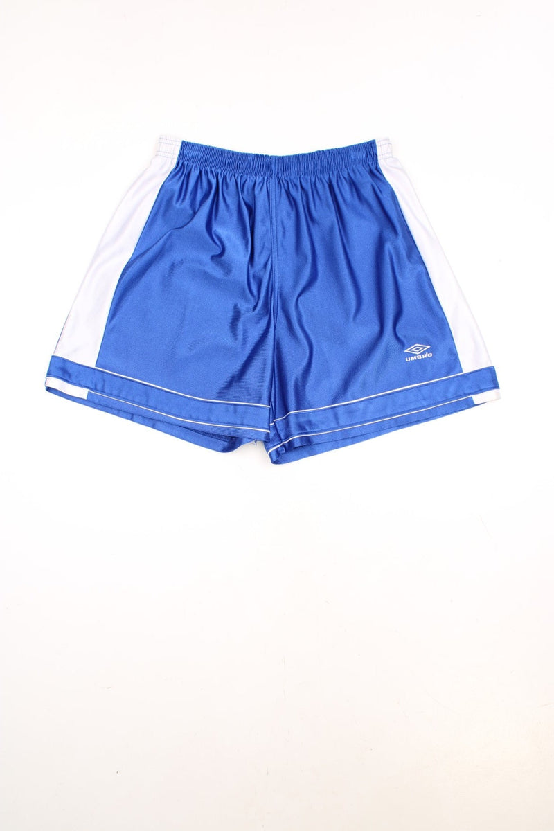 Umbro Basketball Shorts in a blue and white colourway, has an elasticated waist with drawstring, no pockets, and the logo embroidered on the front.