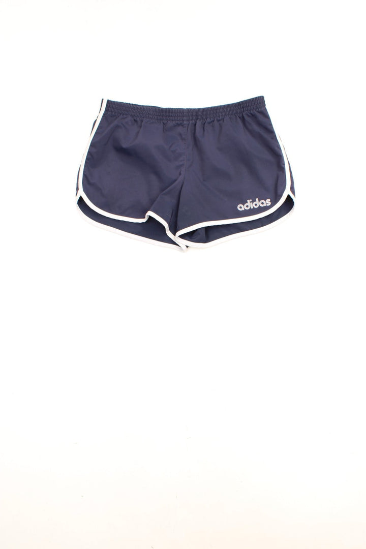 Adidas Running Shorts in a dark blue and white colourway, has an elasticated waist, no pockets, and the logo printed on the front. 