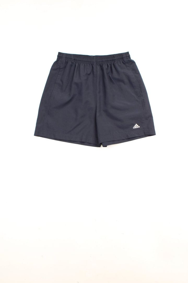 Adidas Shorts in a dark blue colourway, has an elasticated waist with a drawstring, side pockets and the logo embroidered on the front. 