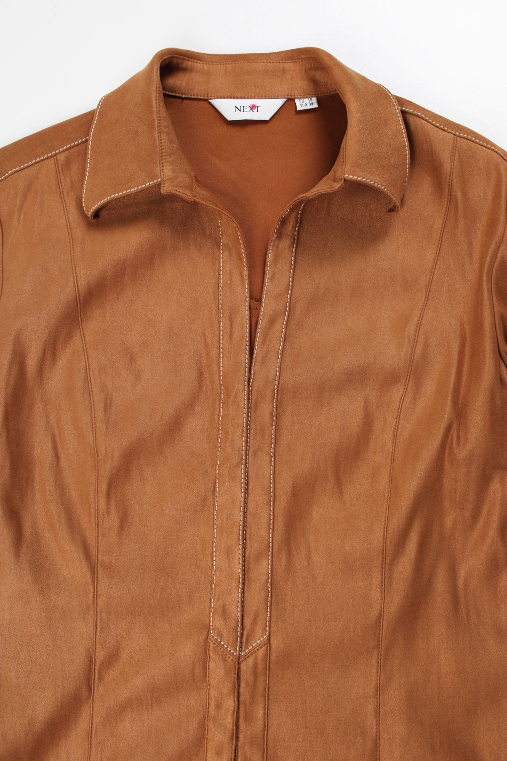 Vintage Y2K Next brown faux suede shirt. Features 3/4 length sleeves, contrast stitch detail and closes with hook and eye fastenings down the front. Made from slightly stretchy material.  good condition  Size in label:   UK 10 (M)