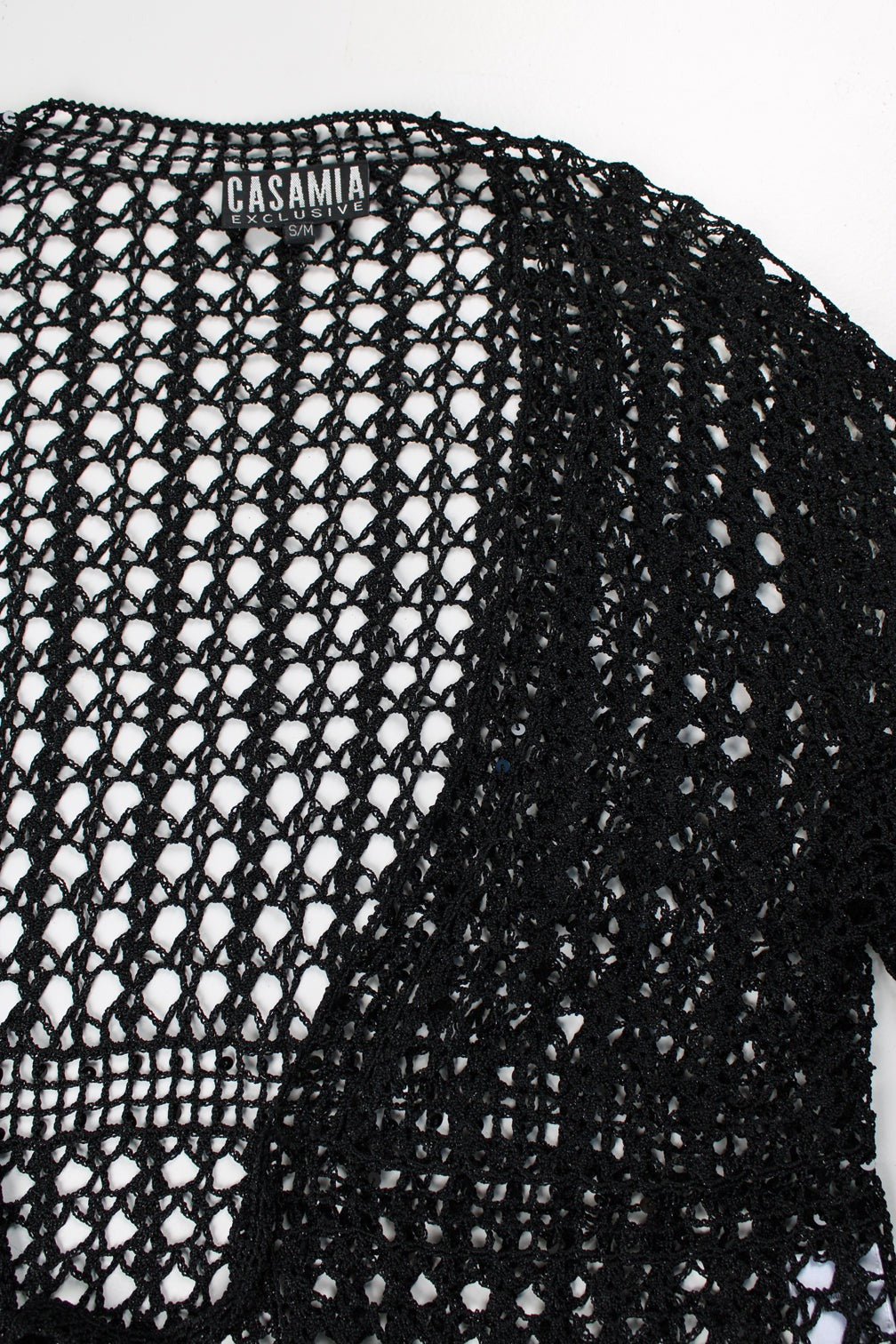 Crochet knit top/ cardigan in black with black glittery thread throughout.