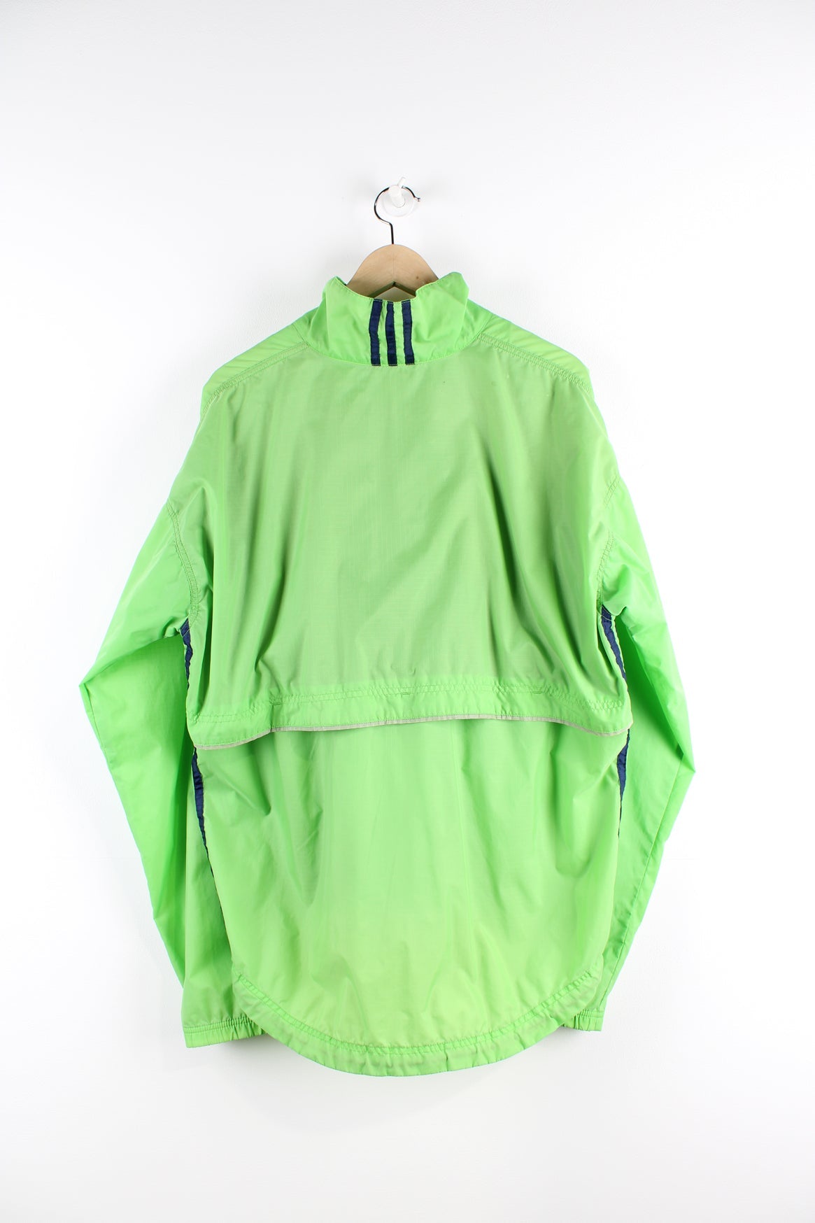 Vintage green tracksuit jacket with embroidered logo on the chest and blue three stripe feature down the front and sides