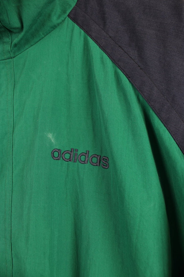 Vintage green and blue Adidas tracksuit jacket with embroidered logo on the chest