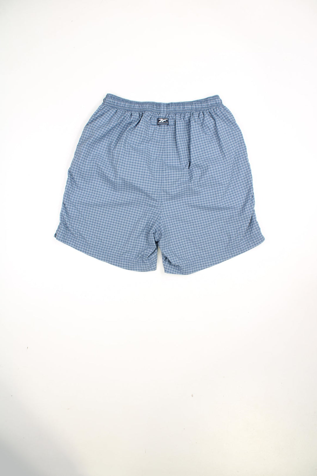 Blue Reebok checked swim shorts with elasticated waist and drawstring. Features embroidered logo.