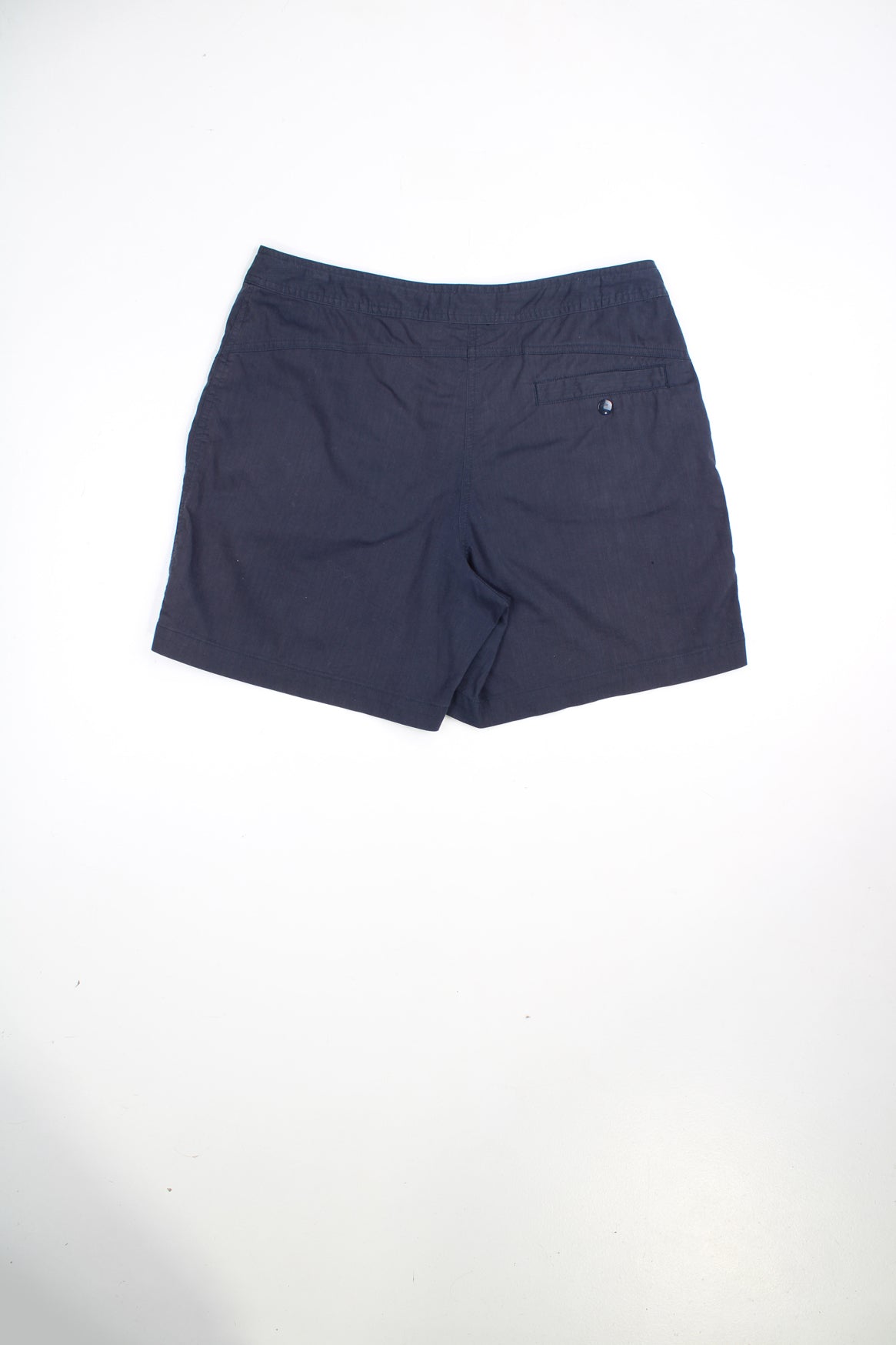 Vintage Ellesse shorts with drawstring and popper fastening. Features embroidered logo.