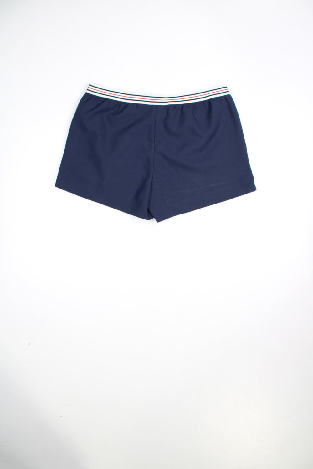 Vintage Fila Hightide 4 shorts in navy. Features striped waistband, embroidered logo and terry towelling detail on the pockets.