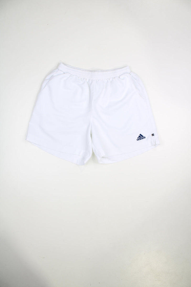 Vintage Adidas shorts with elasticated waist and drawstring. Features embroidered logo on the front and back.