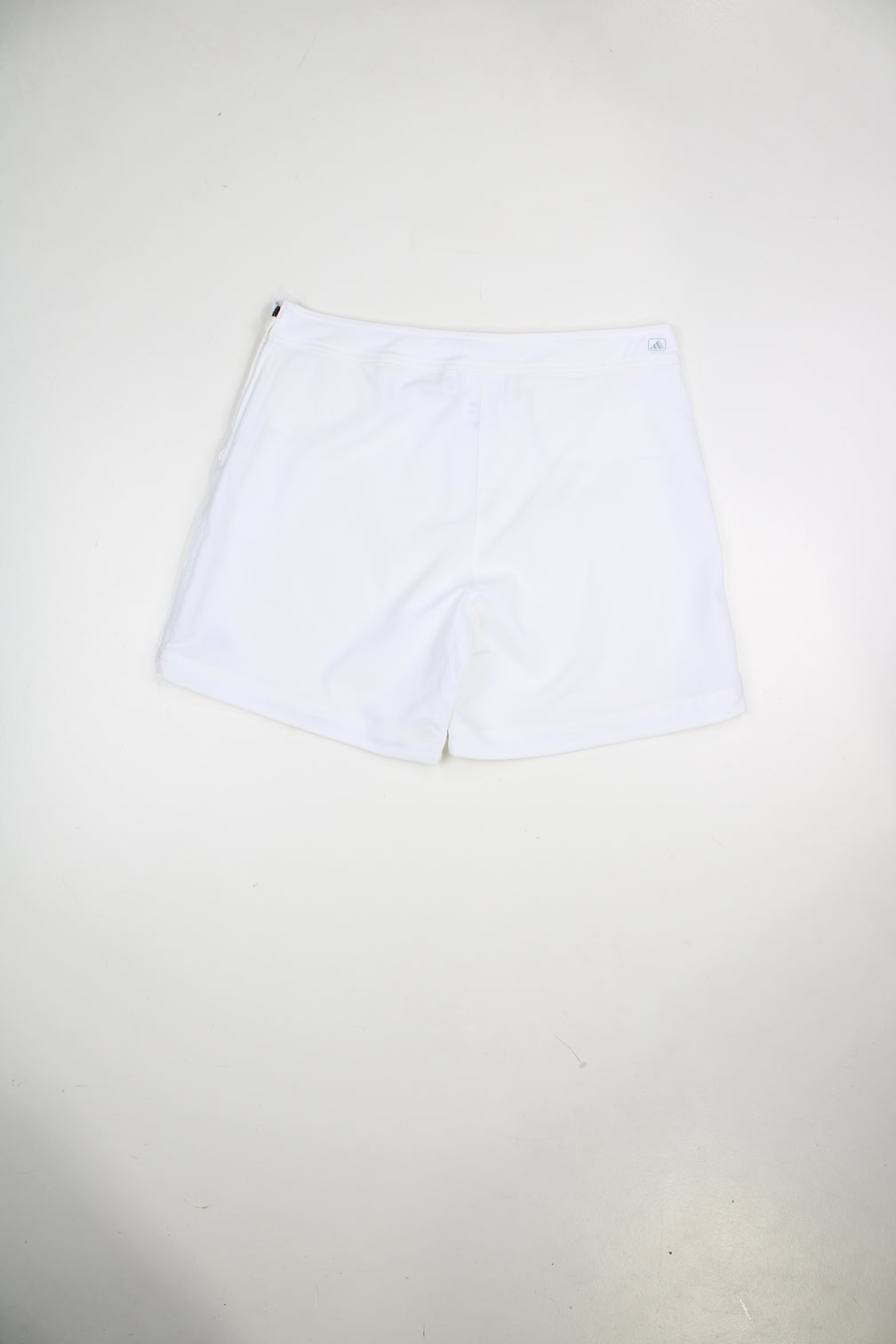 Vintage Adidas white shorts with embroidered logo and zip fastening.